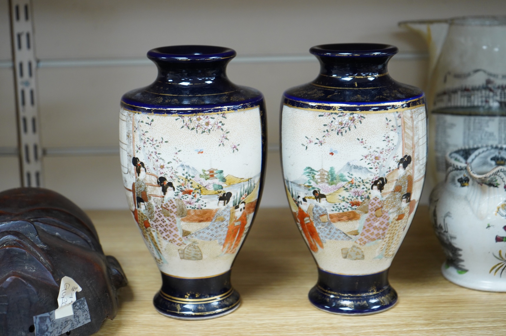 A late 19th century Chinese blue and white vase and cover and two Japanese Satsuma pottery vases, largest 24cm high